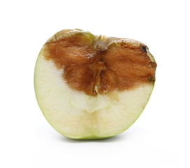 Rotten apple sliced in half isolated on white background