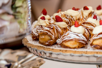 Sfogliatella, typical Neapolitan pastry, with yellow cream and strawberry