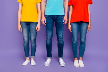 Close up photo of three people standing straight wearing street style clothes isolated violet...