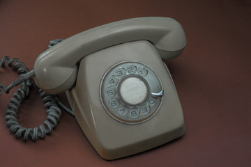 Old telephone with use marks with soft background
