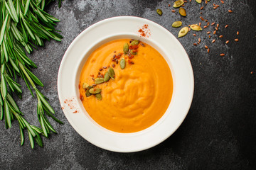 pumpkin or carrot cream soup (first course, healthy food, diet) menu concept. food background. copy space. Top view