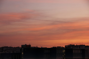 Naklejka premium beautiful sunrise on the city. Heaven is like candy floss