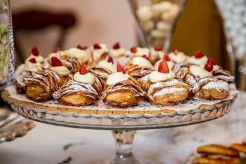 Sfogliatella, typical Neapolitan pastry, with yellow cream and strawberry