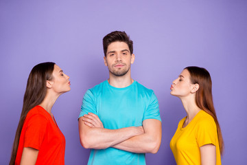 Obraz premium Photo of proud self-confident modern hipster in blue outfit choosing the lady to kiss standing with folded crossed arms isolated violet purple background
