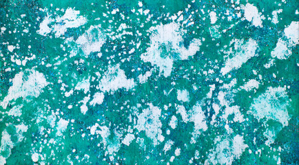 Textural background of turquoise color. Panorama in the form of a texture background with spots, specks. Background malachite color. Abstract wallpaper.