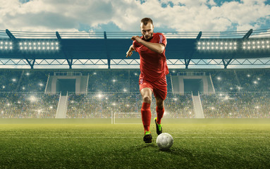 Soccer player in action. Run with a ball. Soccer stadium with cheering fans