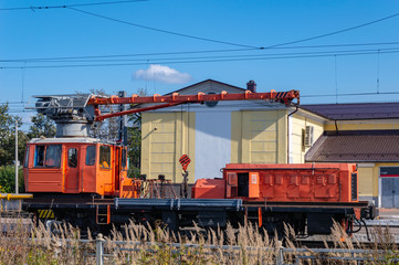 Fototapeta na wymiar Railway platform with a cargo crane.
