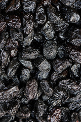Background of dried prunes close-up