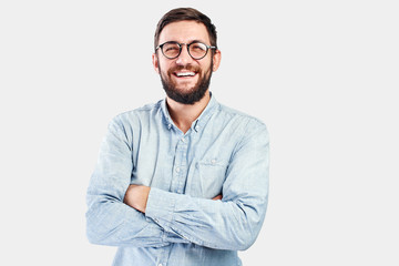 Friendly face portrait of an authentic caucasian bearded man with glasses of toothy smiling dressed...