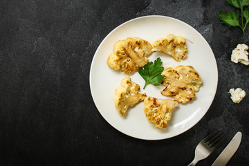 cauliflower grilled (fried grill vegetables or snack salad, bruschetta with tomato) menu concept. food background. copy space. Top view