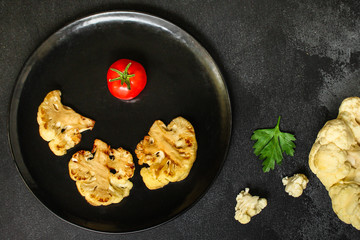 cauliflower grilled (fried grill vegetables or snack salad, bruschetta with tomato) menu concept. food background. copy space. Top view
