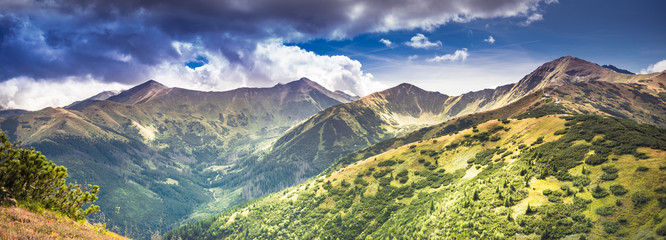 Panorama of Tatra Mountains under stormy clouds with some impressive peaks: Wolowiec, Lopata,...