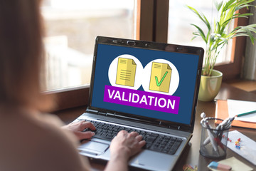 Document validation concept on a laptop screen - obrazy, fototapety, plakaty