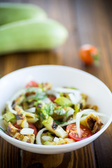 warm grilled zucchini salad with fresh cherry tomatoes and onions