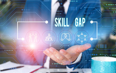 Text sign showing Skill Gap. Business photo showcasing Refering to a demonstrating s is weakness or limitation of knowlege Male human wear formal work suit presenting presentation using smart device
