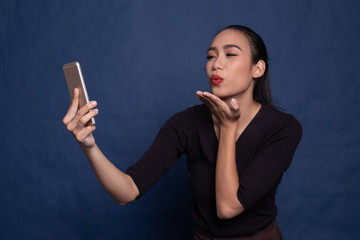 Fototapeta premium Young Asian woman with mobile phone.