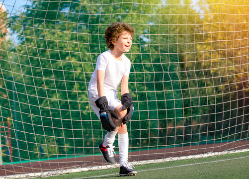 Injury At The Kid Soccer Match Outdoor. Summer Soccer Tournament For Young Kids. Football Club. Emotions And Joy Of The Game.