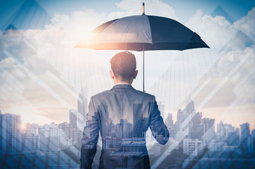 The double exposure image of the Businessmen are spreading umbrella during sunrise overlay with cityscape image. The concept of modern life, business, insurance and protection. - obrazy, fototapety, plakaty