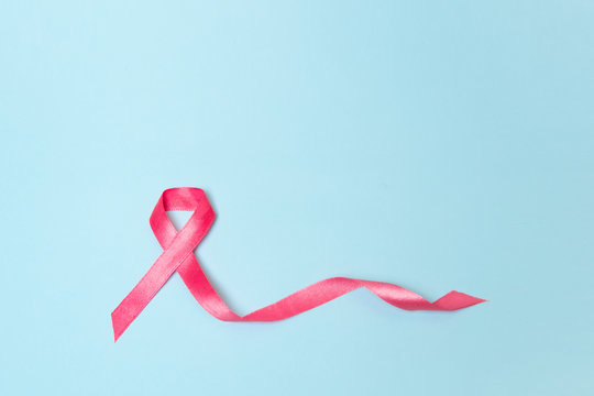 pink ribbon on a blue background. mammary cancer symbol
