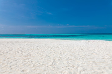 Fototapeta na wymiar Empty beach landscape. Sea sand sky concept. Calmness and loneliness concept of beach view and horizon under blue sky