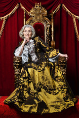 Obraz na płótnie Canvas Portrait of beautiful senior queen on throne
