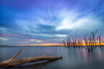Fototapeta na wymiar Cedar Bluff State Park, KS USA - Peaceful Blue Hour over the Cedar Bluff Lake