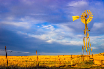 Saline County, KS USA - Aermotor Windmill in the Prairie at Sunset - obrazy, fototapety, plakaty