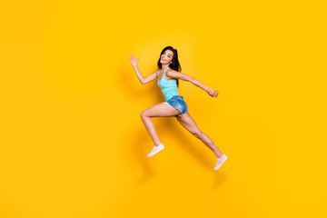 Full length body size photo of youngster of beauty aspiring to come on time for sales at shopping mall being free wearing jeans denim shorts isolated over bright color background
