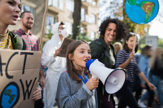 Small child with amplifier on global strike for climate change.