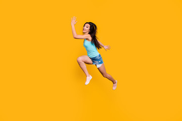 Fototapeta na wymiar Full length body size photo of cheerful excited runner getting tired of moving reaching for aims ahead wearing jeans denim shorts approaching you isolated vivid color background