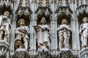 Group of statues from medieval facade on Grand Place in Brussels Belgium.