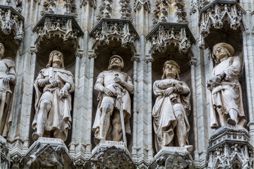 Group of statues from medieval facade on Grand Place in Brussels Belgium.