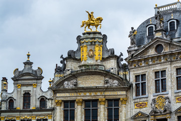 Fototapeta na wymiar Rooftop sculptures of opulent buildings at Grand Place, Brussels City, Belgium. Brussels, Belgium