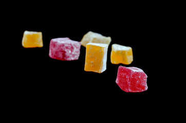 Sweets Turkish sweets on a black background. Isolated Candied