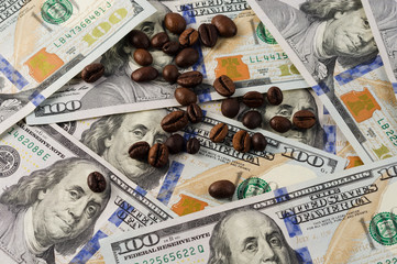 Coffee beans on the background of American dollars