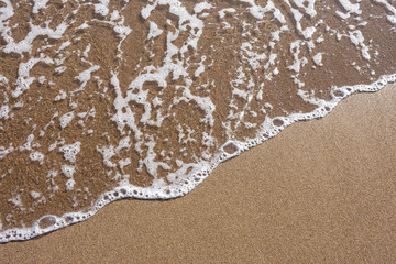 Close up sea water waves with bubbles