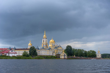 Obraz premium Picturesque view of Nilo Stolobensky Monastery on Lake Seliger, Tver region, Russia. Panoramic view of Nilo Stolobensky Monastery, Tver region, Russia.