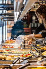View of a caterer serving food at the market hall