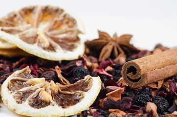 Berry tea with anise stars. lemon and cinnamon sticks