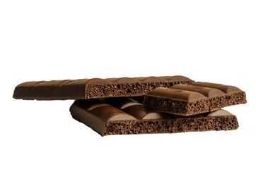 Slices of porous chocolate on a white background