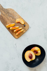  White background with fruits. Composition with fresh peaches on a wooden background, flatlay