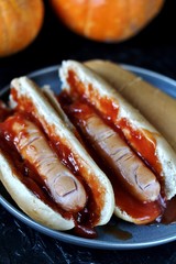 Hot Dog for Halloween. a hot dog sausage in a severed finger in abundance ketchup as blood. Food...
