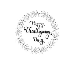 Happy Thanksgiving day greeting card with hand drawn calligraphy and autumn leaves.
