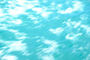 Abstract blurred background, water surface with white spots.