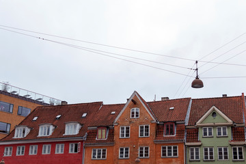Fototapeta premium Colorful old town street with wooden rustic houses, typical Danish capital architecture