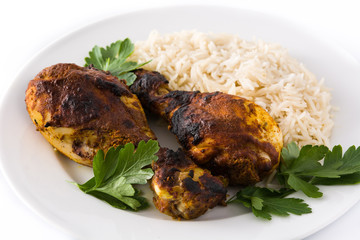 Roasted tandoori chicken with basmati rice in plate isolated on white background