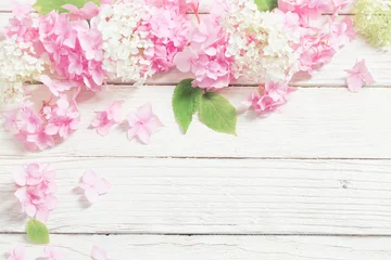 Zelfklevend Fotobehang pink hydrangea on white wooden background © Maya Kruchancova