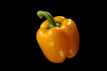 fresh salad pepper vegetable on a black background