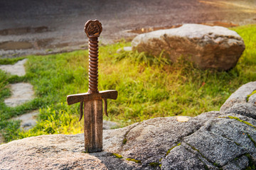 Excalibur, King Arthur's sword in stone. Edged weapons from the legend Pro king Arthur.