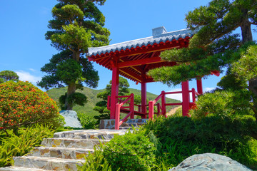 Japanese garden with red pagoda, beatiful landscape and blue sky in dendra park in Vietnam